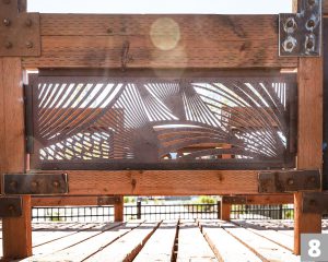 A Corten steel panel laser cut with a design for the Three Creeks Confluence Park