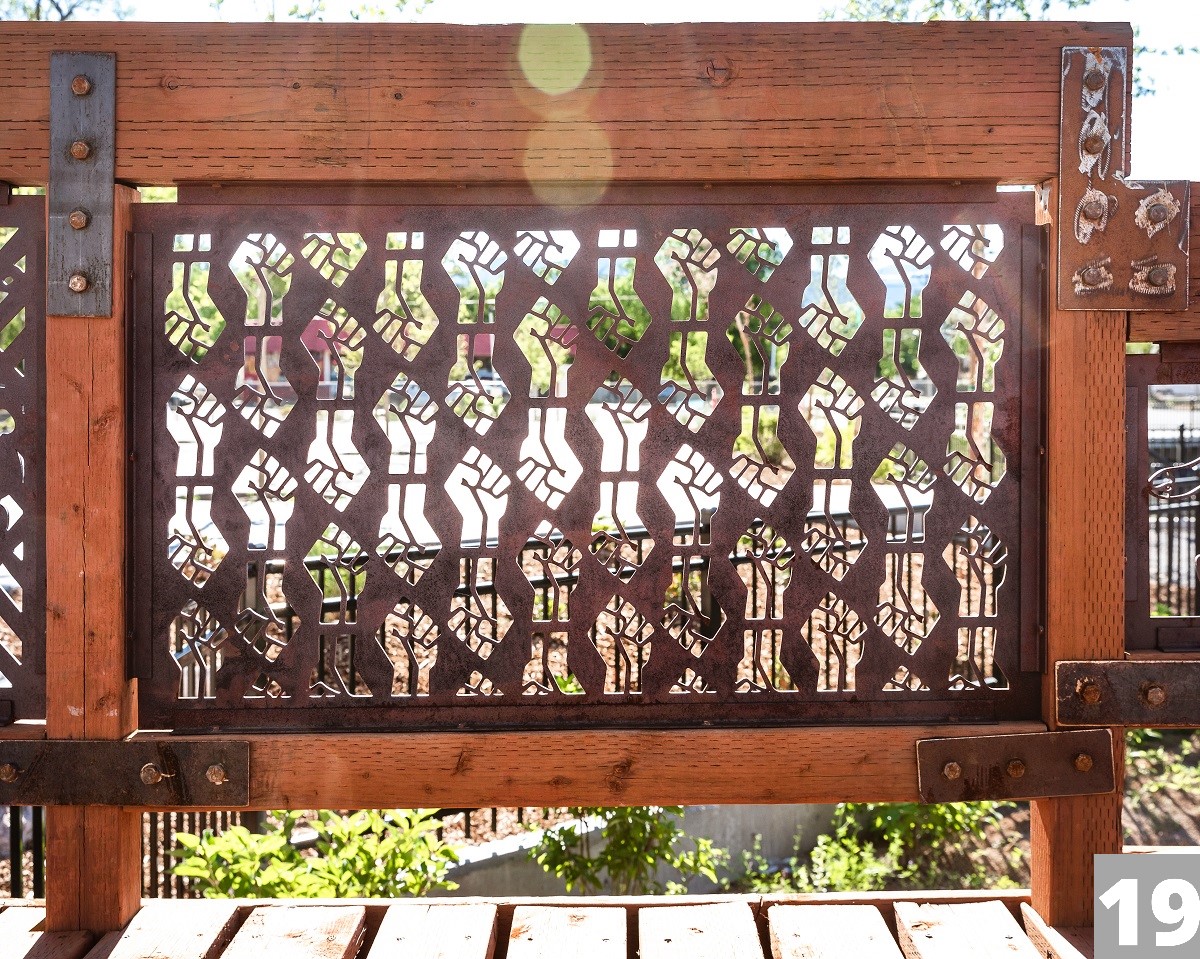 A Corten steel panel laser cut with a design for the Three Creeks Confluence Park